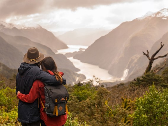 Couple at the Wilmot pass overlooking Doubtful Sound