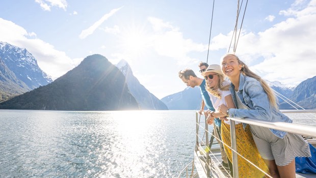 Group of friends on a cruise in Milford Sound on a sunny day