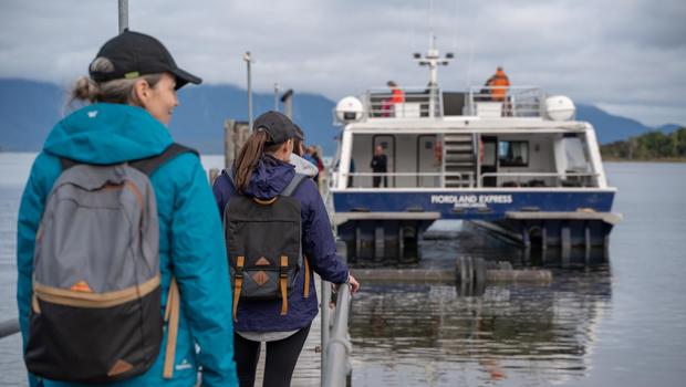 Walkers boarding the Milford Track Ferry at Te Anau Downs