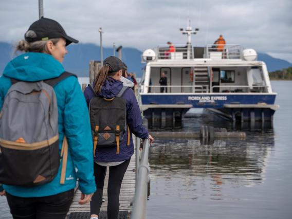 Walkers boarding the Milford Track Ferry at Te Anau Downs