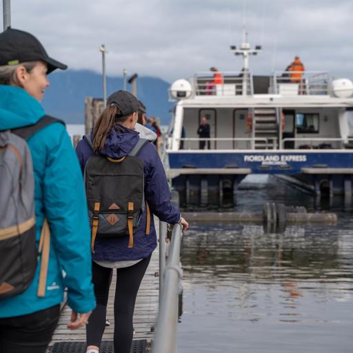 Walkers boarding the Milford Track Ferry at Te Anau Downs