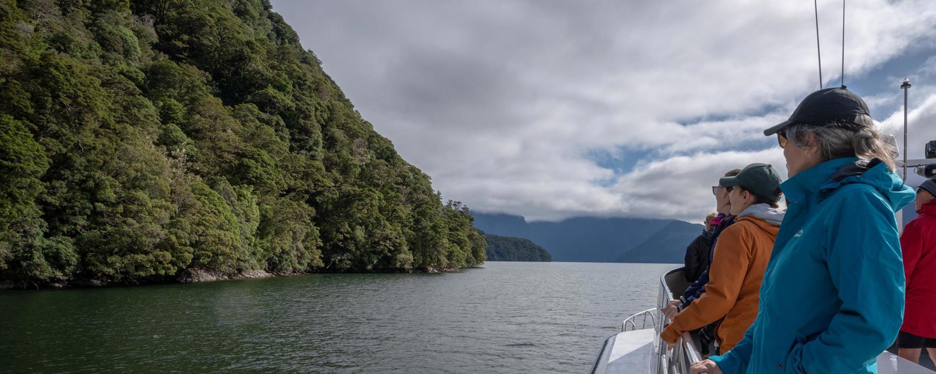 Walkers onboard the ferry, on the way to start the Milford Track Great Walk