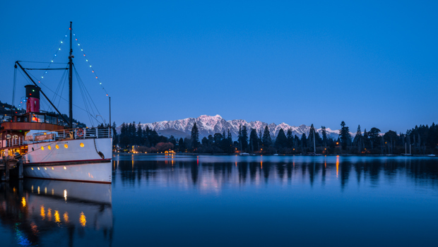 TSS Earnslaw with snow capped mountains