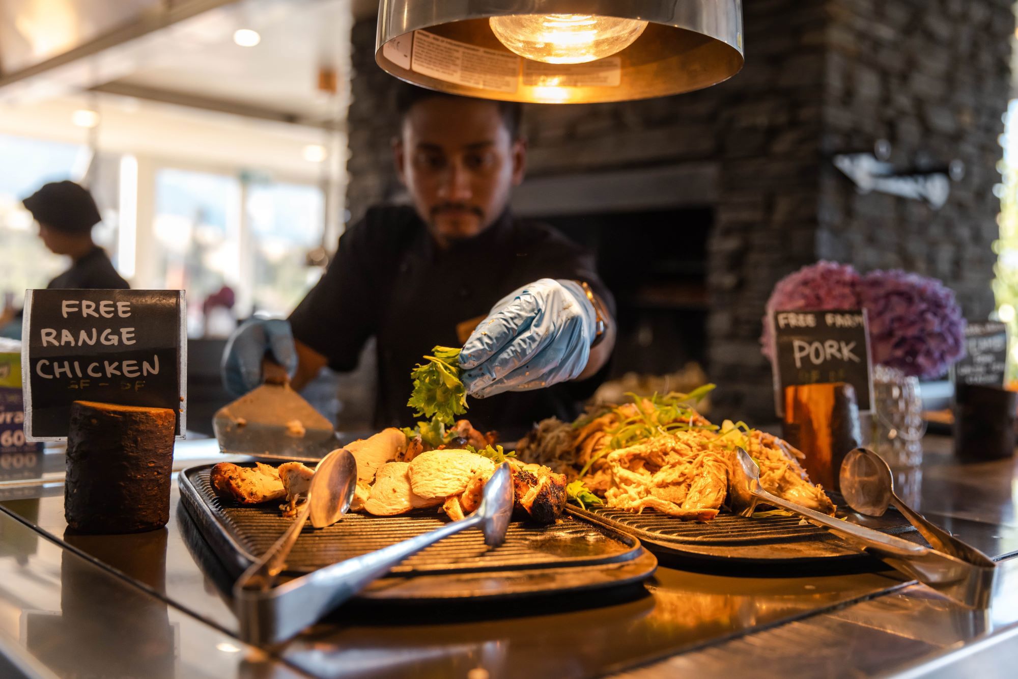 Chef serving BBQ meats