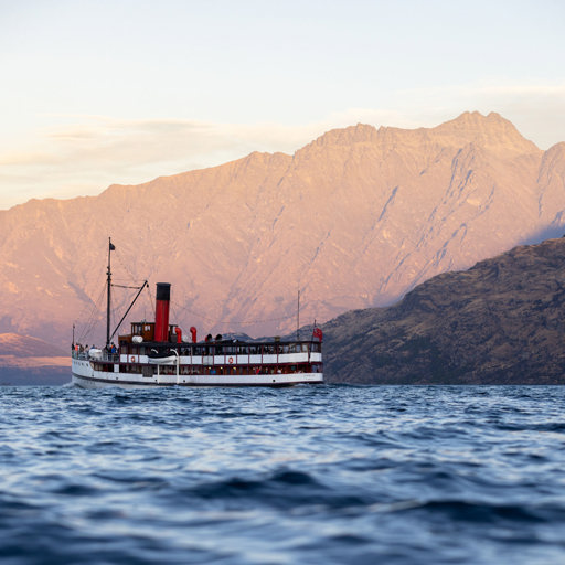 The TSS Earnslaw sailing in front of the Remarkables