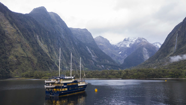 The Milford Mariner vessel cruises through Milford Sound