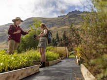 A guest receiving her tree to plant at walter peak eco experience