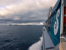 Hanging out the side of the ferry, a view towards Stewart Island