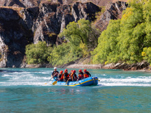 A raft paddling down the Kawarau River