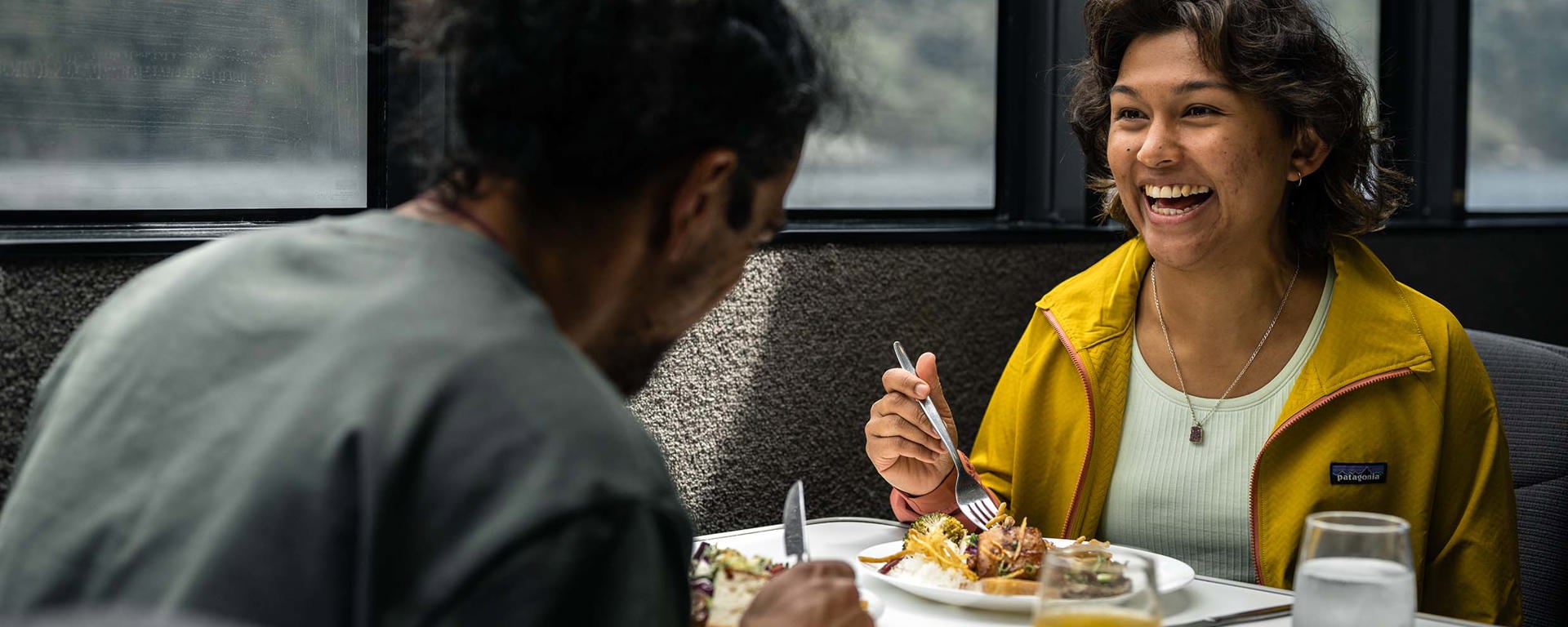 A couple enjoy a sit down lunch onboard their Milford Sound cruise 