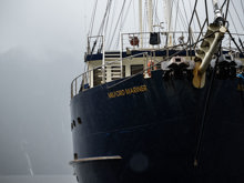 A close shot of the bow of the Milford Wanderer overnight vessel on a moody day