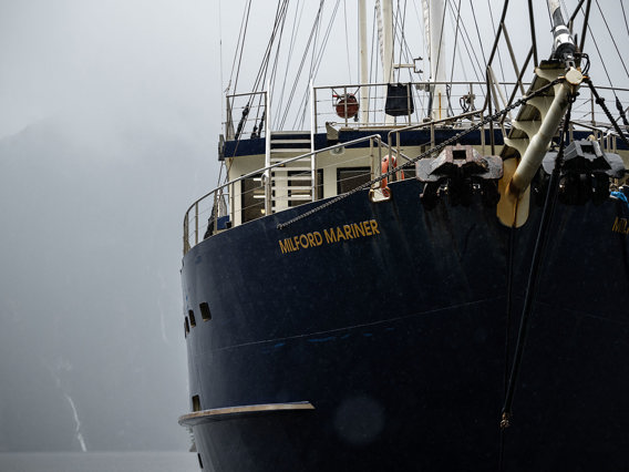 A close shot of the bow of the Milford Wanderer overnight vessel on a moody day