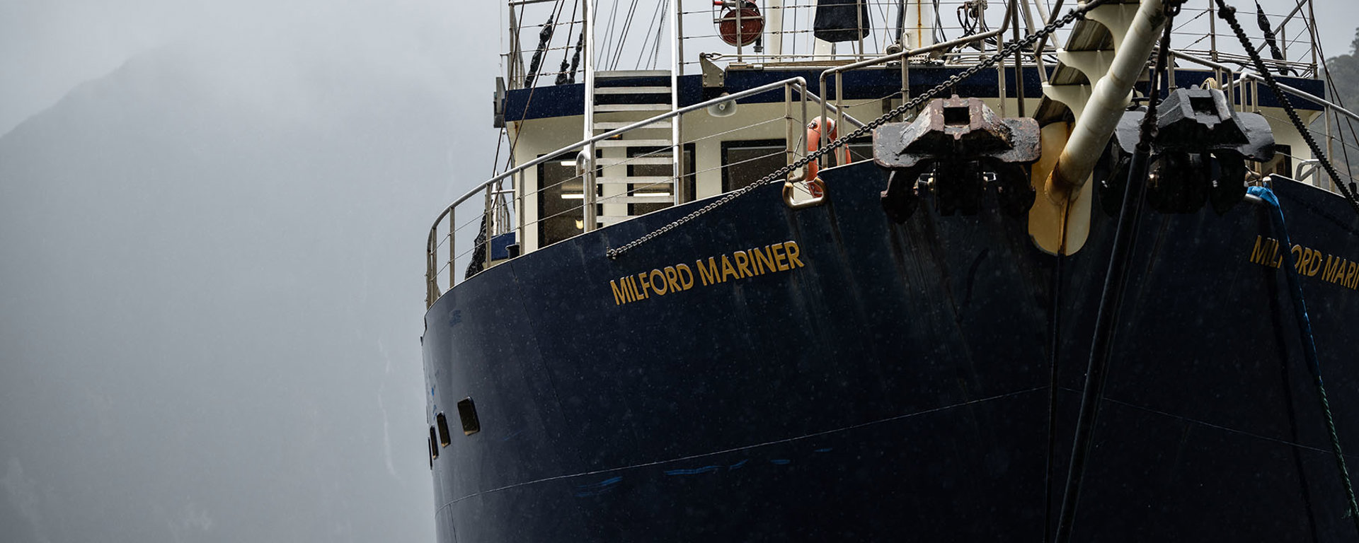 A close shot of the bow of the Milford Wanderer overnight vessel on a moody day