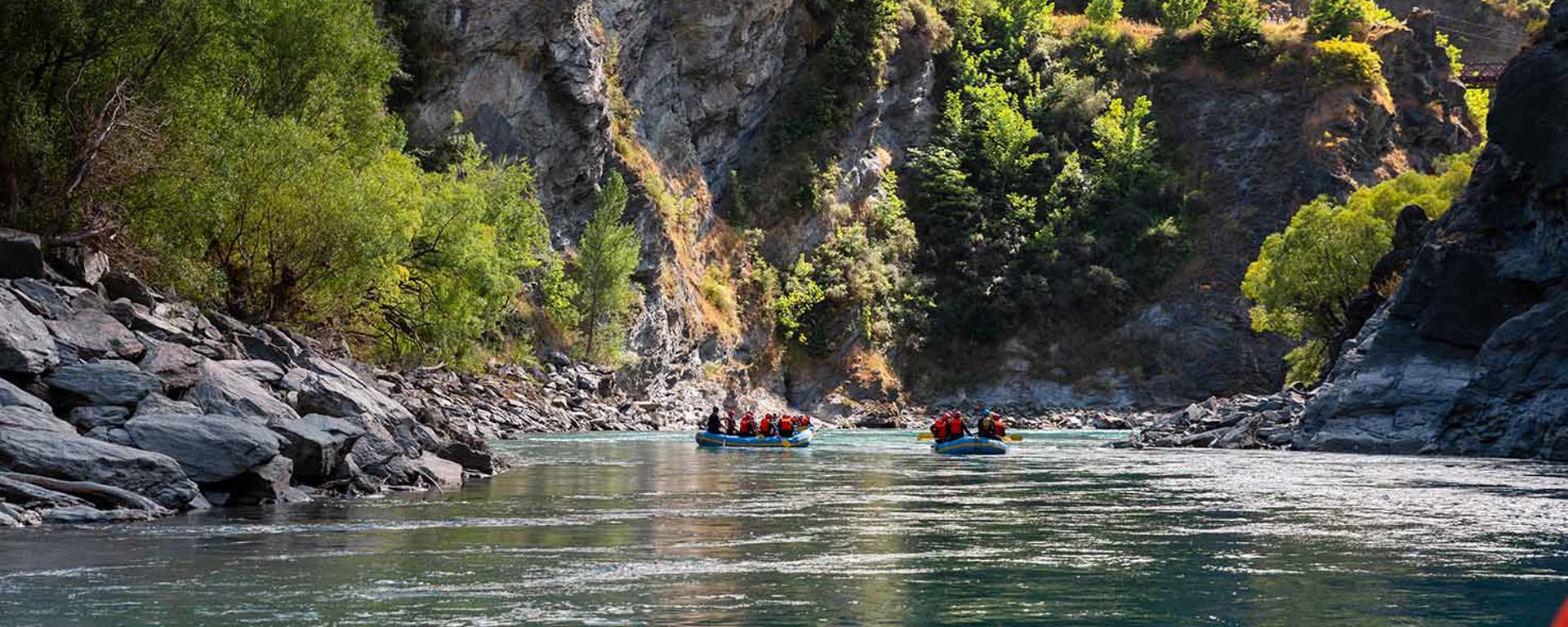 Two rafts paddling on the Kawarau river