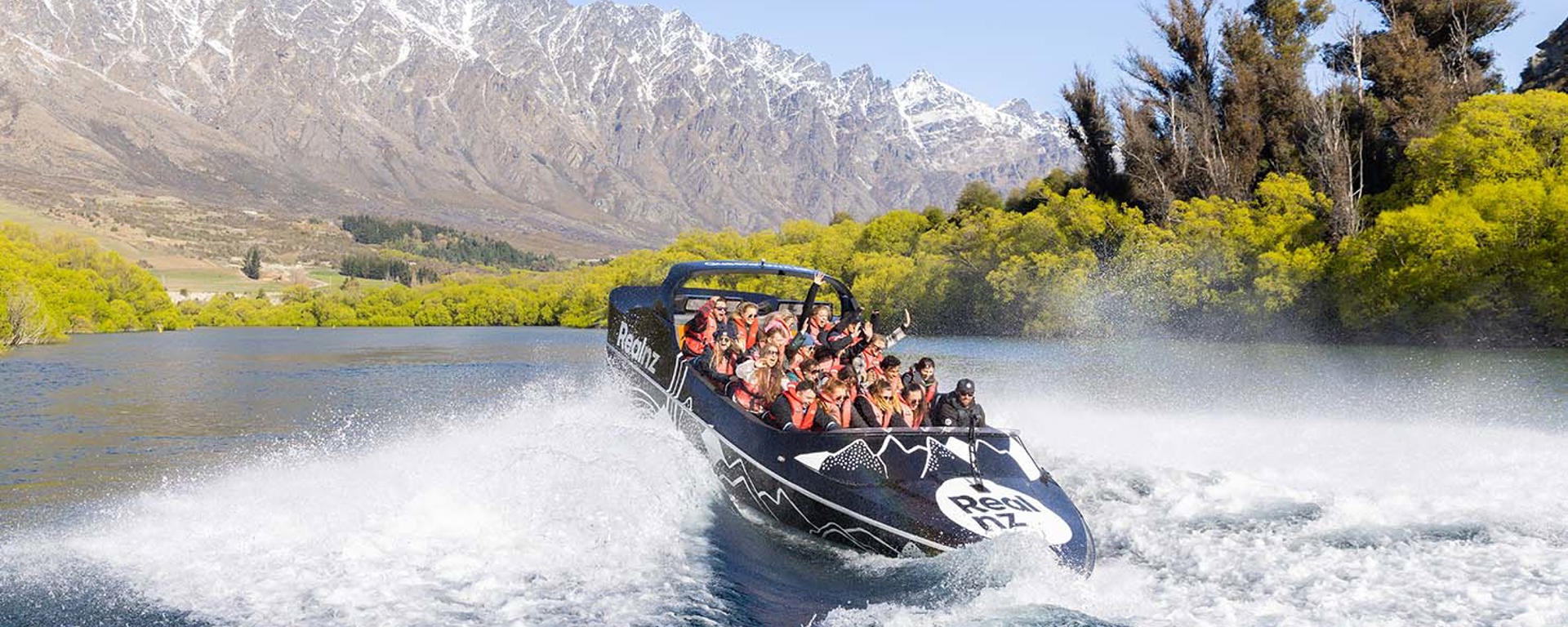 A queenstown jetboat does a 360 spin on the Kawarau River