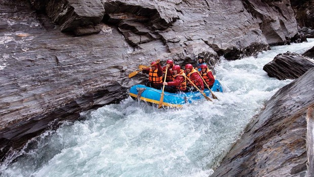 A group of rafters taking on the shotover river