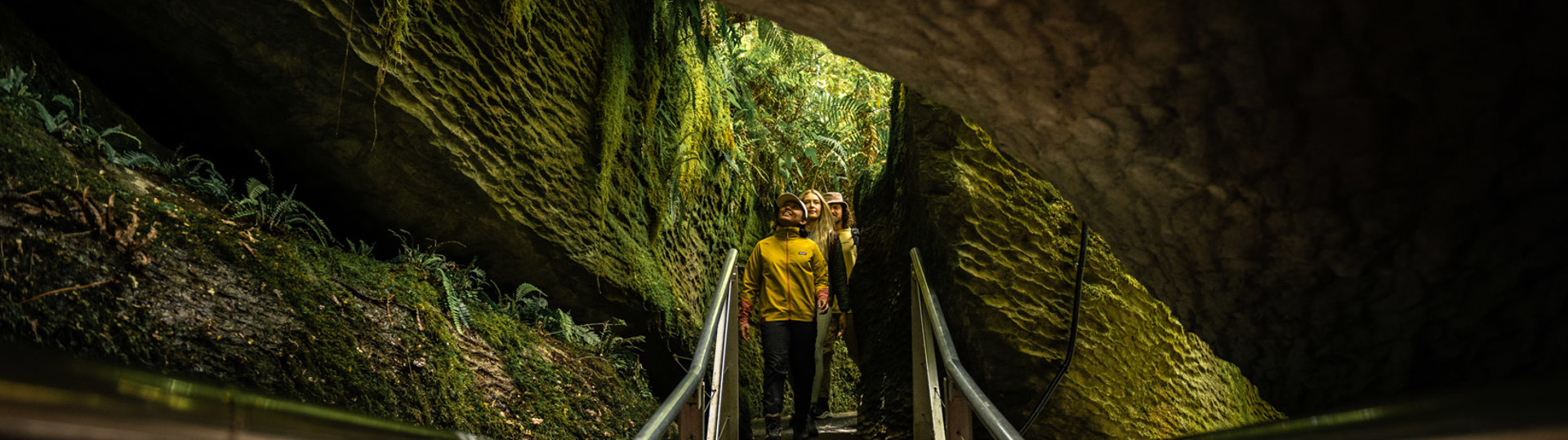 a group of people walking down into the caves