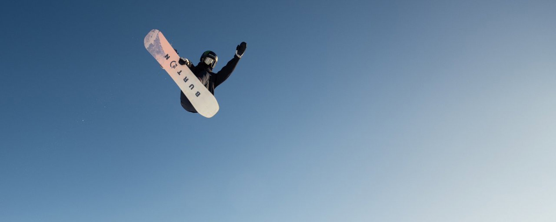 A snowboarder gets some height of the halfpipe at the Cardrona park