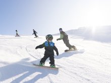 A family ride down the piste at cardrona alpine resort