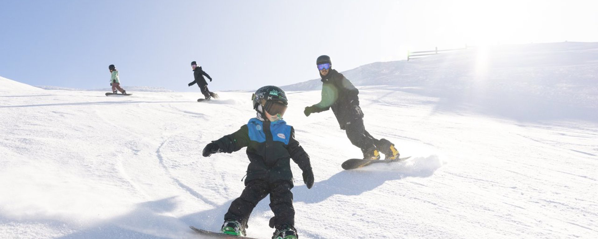 A family ride down the piste at cardrona alpine resort