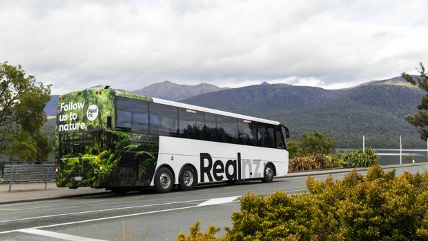 A real nz coach waiting at Te Anau visitor centre to pick up guests