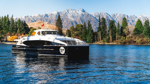 Spirit of Queenstown on the water in front of the remarkables