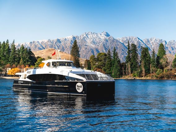 Spirit of Queenstown on the water in front of the remarkables