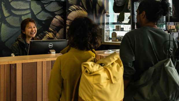 A Milford Sound Customer Service Consultant welcomes guests.