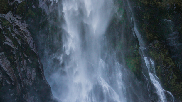 A dramatic waterfall at Milford Sound