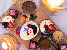 A spread of colourful desserts on a wooden board at Walter Peak in Queenstown.