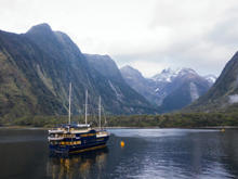 Experience Milford Sound in style aboard the Mariner—your home for an unforgettable overnight adventure surrounded by towering peaks and tranquil waters.