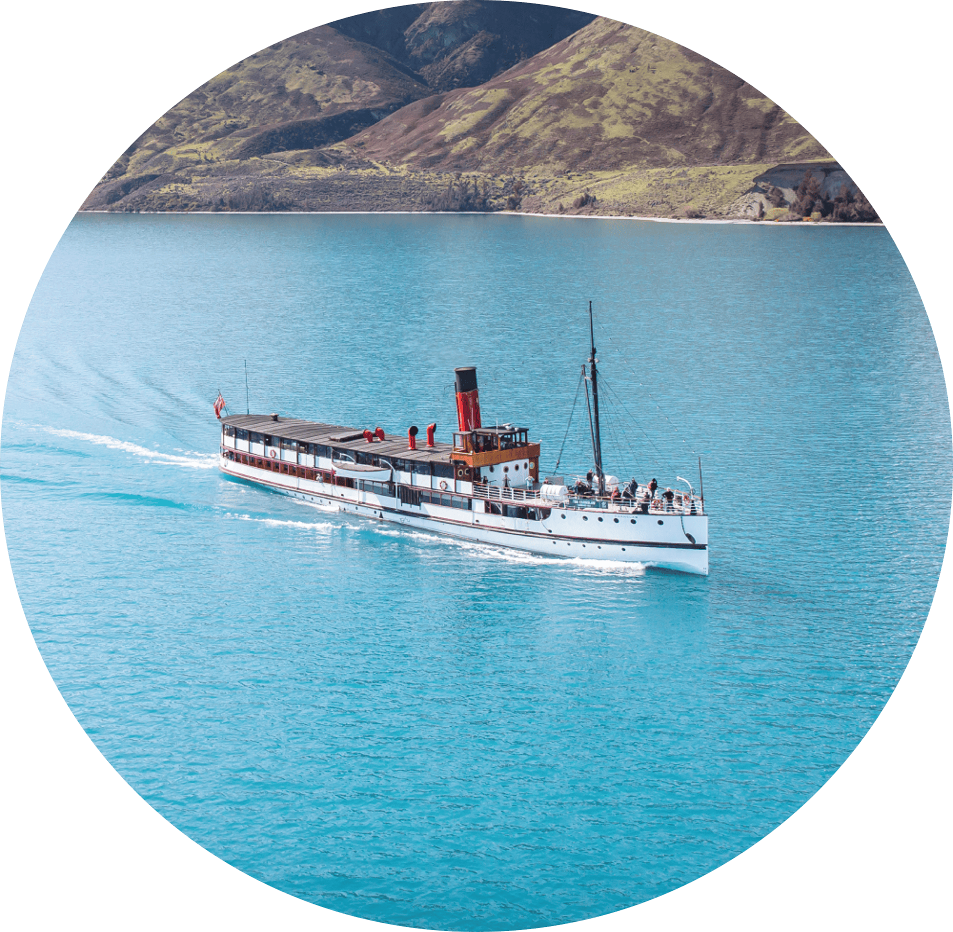 The TSS Earnslaw cruises across Lake Whakatipu on its way to Walter Peak High Country Farm.